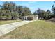 Exterior front view of home and covered carport at 12461 Se 126Th Ct, Ocklawaha, FL 32179