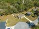 An aerial view of the house, driveway, backyard, fence and shed at 13 Pine Course Radl, Ocala, FL 34472