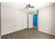 Bedroom with carpet, ceiling fan, and double-door closet at 13 Pine Course Radl, Ocala, FL 34472