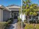 Inviting front entrance with well-maintained landscaping and decorative front door at 13340 Se 86Th Cir, Summerfield, FL 34491