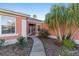 Close up of the front exterior with meticulous landscaping leading up to the front door at 13625 Se 93Rd Court Rd, Summerfield, FL 34491