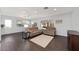 Bright living room with neutral colored walls and flooring and views of the outside at 13625 Se 93Rd Court Rd, Summerfield, FL 34491