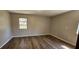 Bright bedroom with wooden floors and plenty of natural light at 14805 Se 51St Ct, Summerfield, FL 34491