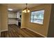 Dining area with updated lighting and floor. Window provides lots of natural light at 14805 Se 51St Ct, Summerfield, FL 34491