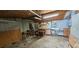 Interior of an outbuilding with garage door, overhead lighting, work benches and shelving at 14805 Se 51St Ct, Summerfield, FL 34491