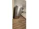 Beautiful kitchen with stainless steel refrigerator and stylish wood flooring at 14805 Se 51St Ct, Summerfield, FL 34491