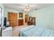 Bright bedroom with carpet, ceiling fan, and ample closet space at 1912 Se 169Th Ct, Silver Springs, FL 34488