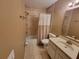 Bathroom featuring a shower/tub combination, white curtain and vanity sink at 2211 Ne 45Th Ave, Ocala, FL 34470