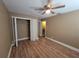 Comfortable bedroom with hardwood floors and a closet, perfect for relaxation at 2211 Ne 45Th Ave, Ocala, FL 34470