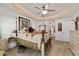 Charming main bedroom featuring a four-poster bed, decorative accents, and ample natural light at 3925 Ne 58Th Cir, Silver Springs, FL 34488