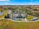 Aerial view of the community clubhouse, offering modern amenities, parking, and outdoor gathering spaces at 6185 Sw 89Th Ct, Ocala, FL 34481