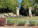 Stone Creek neighborhood entrance featuring stone accents, landscaping, and community signage at 6185 Sw 89Th Ct, Ocala, FL 34481