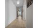 Bright hallway showcases textured walls and wood-look flooring at 6185 Sw 89Th Ct, Ocala, FL 34481