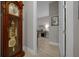 Hallway with a view into the office, featuring a grandfather clock at 6185 Sw 89Th Ct, Ocala, FL 34481