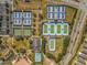 Aerial view of a sports complex featuring tennis courts, bocce ball, and a basketball court at 6185 Sw 89Th Ct, Ocala, FL 34481