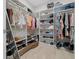 Organized walk-in closet with ample storage and custom shelving for clothes and shoes at 6185 Sw 89Th Ct, Ocala, FL 34481