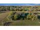 Aerial view of the home showcasing mature trees, a well maintained yard, and a serene atmosphere at 6890 Nw 21St St, Ocala, FL 34482