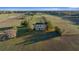 Wide aerial shot of the property, with the house and training areas centrally located within at 6890 Nw 21St St, Ocala, FL 34482