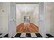 Living room with wooden floors and chandelier at 6890 Nw 21St St, Ocala, FL 34482