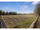 Lush pasture with sturdy wooden fence, ideal for livestock grazing at 6890 Nw 21St St, Ocala, FL 34482