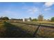 Picturesque shed surrounded by lush pasture and wooden fencing, offering functional storage and rural charm at 6890 Nw 21St St, Ocala, FL 34482