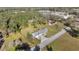 Aerial view of a single Gathering home with a gray roof, sitting on a large plot of land at 7010 Nw 44Th Ave, Ocala, FL 34482