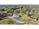 Aerial view of the home nestled within a large, tree-filled property at 7010 Nw 44Th Ave, Ocala, FL 34482