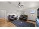 Well-lit living room with hardwood floors, a ceiling fan, and comfortable seating at 7010 Nw 44Th Ave, Ocala, FL 34482