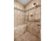 Shower featuring tiled walls, bench seat, and multiple shower heads at 7010 Nw 44Th Ave, Ocala, FL 34482