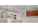 Living room with tile floors, media center and window with great natural lighting at 7151 Sw 96Th Ct, Ocala, FL 34481