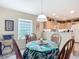 Bright dining area with a view of the updated kitchen at 7340 Sw 111Th Ln, Ocala, FL 34476