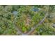 Aerial view of the home showcasing a private pool and lush surroundings in a quiet neighborhood at 7810 Sw 186Th Cir, Dunnellon, FL 34432