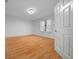 Light and airy bedroom with light wood floors, a window with sheer curtains, and a ceiling light at 7810 Sw 186Th Cir, Dunnellon, FL 34432