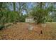 A shed in the backyard offers extra storage with mature landscaping at 7810 Sw 186Th Cir, Dunnellon, FL 34432