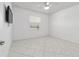 Bright bedroom featuring tile floors, a modern ceiling fan, and a window with blinds at 8719 Sw 76Th Street Rd, Ocala, FL 34481