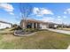 Well-maintained single-story home with mature landscaping, long driveway, and a two-car garage at 8719 Sw 76Th Street Rd, Ocala, FL 34481