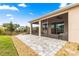 Back patio featuring paved stone and low-maintenance landscaping at 8861 Sw 63Rd Ct, Ocala, FL 34476