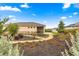 Manicured backyard landscaping with a winding stone path, flowers and mature plants at 8861 Sw 63Rd Ct, Ocala, FL 34476