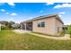 Backyard featuring a manicured lawn and an extended screened lanai at 8861 Sw 63Rd Ct, Ocala, FL 34476