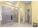 Bathroom with a glass-enclosed shower featuring tile surround and a built-in seat at 8861 Sw 63Rd Ct, Ocala, FL 34476