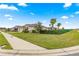 Beautifully landscaped lawn and a lush green lawn surround the homes exterior at 8861 Sw 63Rd Ct, Ocala, FL 34476