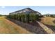 Manicured landscaping adds a touch of nature around the screened-in pool area and house at 8864 Sw 85Th Loop, Ocala, FL 34481