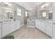 Bright main bathroom boasts dual sinks, a stand alone shower, and modern fixtures at 8864 Sw 85Th Loop, Ocala, FL 34481