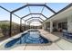 This inviting screened-in pool is a highlight of the outdoor space, perfect for enjoying sunshine and relaxation at 8864 Sw 85Th Loop, Ocala, FL 34481