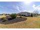 The side view of this home showcases its lovely landscaping at 8864 Sw 85Th Loop, Ocala, FL 34481