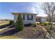 Manicured landscaping and blue shutters surround this charming single Gathering home at 8864 Sw 85Th Loop, Ocala, FL 34481