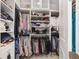 Organized walk-in closet with custom shelving, hanging rods, and ample storage space at 8864 Sw 85Th Loop, Ocala, FL 34481