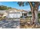 Beautiful home featuring a two-car garage, manicured lawn, and a welcoming facade at 9064 Sw 91St Cir, Ocala, FL 34481