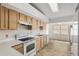 Well-lit kitchen featuring white countertops, ample cabinetry, and modern appliances for convenient cooking at 9064 Sw 91St Cir, Ocala, FL 34481