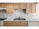 Kitchen showcasing ample cabinet space, a stainless steel sink, and modern appliances for meal preparation at 9064 Sw 91St Cir, Ocala, FL 34481